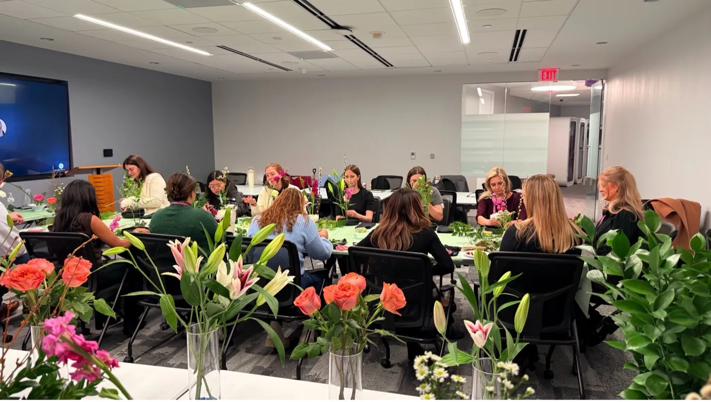 Narcisa guiding an on-site corporate Ikebana team building workshop in Maryland or Northern Virginia